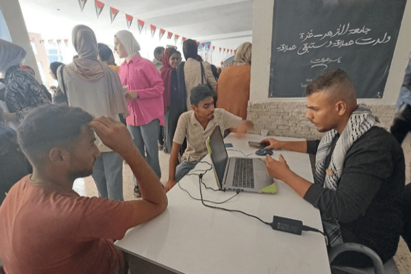 Admitting new students amidst the rubble in a tent in Gaza